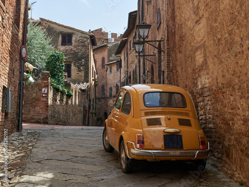 Quadro su tela Classic vintage car parked in a narrow historic street of the ancient town Certa