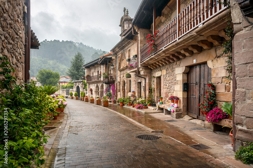 Main street and historic center of the picturesque village of Riocorvo, Cantabria, Spain.