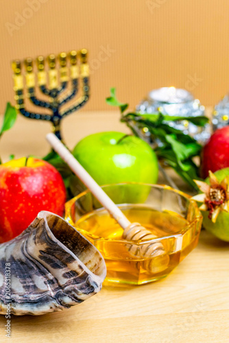 Rosh hashanah symbols with apples, honey, and shofar