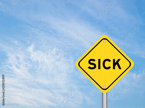Yellow transportation sign with word sick on blue color sky background