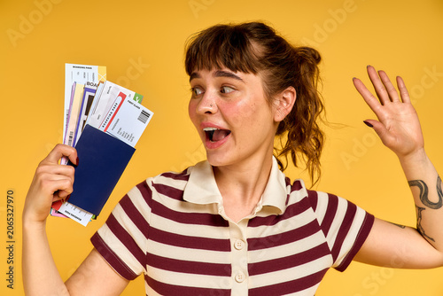 Excitement of a young woman in trendy summer outfit ready for her travel adventure