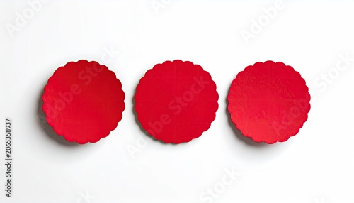 Three Red Circular Silicone Baking Molds Arranged in a Row.