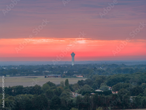 Water Tower at Sunset Over Rural Landscape, Mache, France