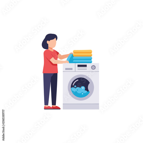 Woman Loading Washing Machine with Towels.