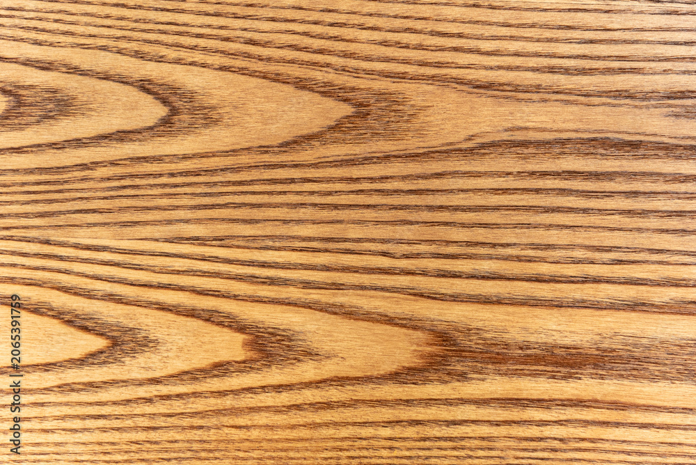 Obraz premium Natural ash wood texture background with beautiful wavy grain pattern.