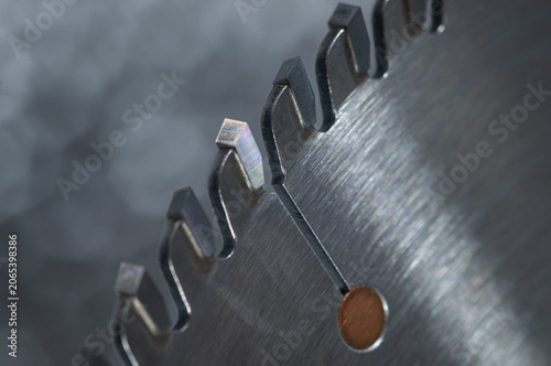 Macro close-up of a professional TCT circular saw blade with sharp carbide teeth.