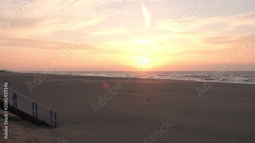 Cinematic Sunset Over Empty Beach with Ocean Horizon and Golden Sky – Tranquil Coastal B-Roll Footage