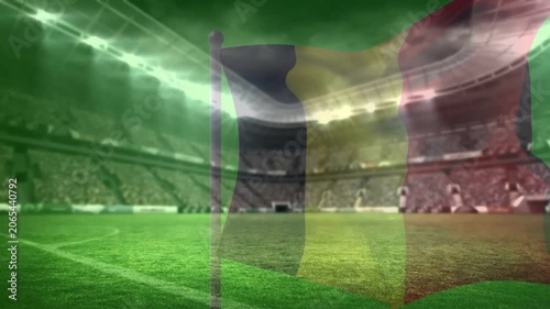 Stadium breeze starting tricolor flag swinging right and back, stripes pulsing, settling over pitch