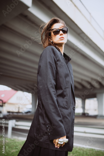 Fashion street portrait of a modern emotional woman