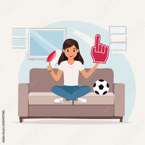 Woman cheering for sports game at home