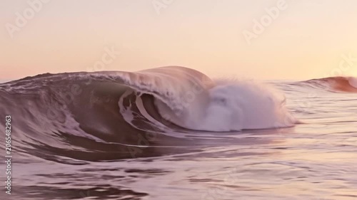 Golden Hour Ocean Wave Crashing with Spray and Sunlight Reflections