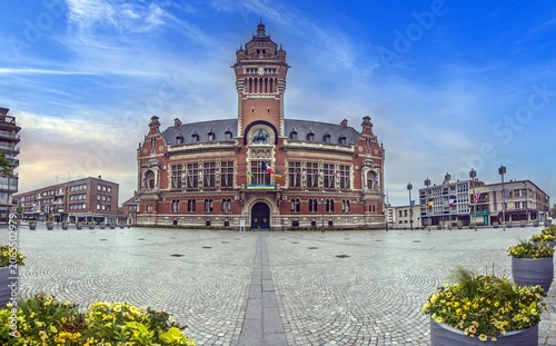 Historic town hall of Dunkirk France with wide square