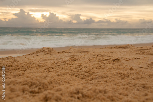 Sand in the foreground and the sea in the distance. Sea sand