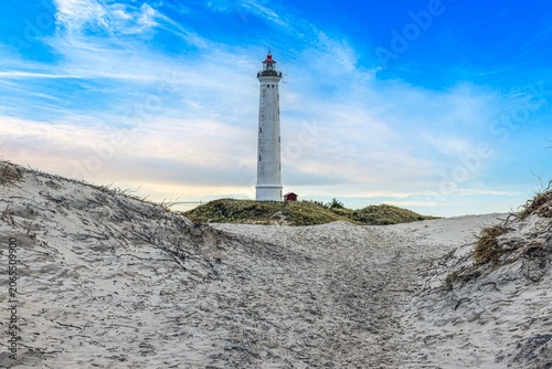 Hvide Sande lighthouse surrounded by dunes in Denmark