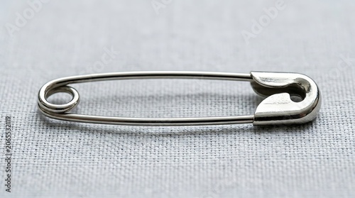 Classic safety pin with secure clasp mechanism