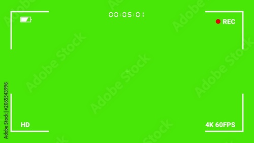 Digital camera viewfinder with recording indicator on green screen background.