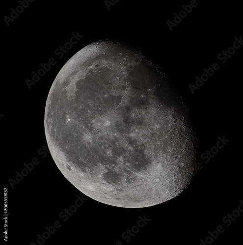Fényképezés Detailed astrophotography of a waning gibbous moon (Luna) isolated on a pitch bl