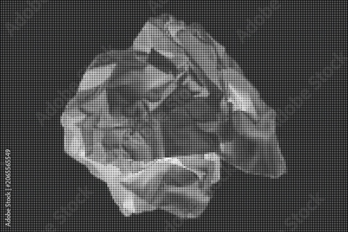 Crinkled metallic object on a plain background with a close-up view