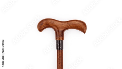 Wooden cane with curved handle on white background
