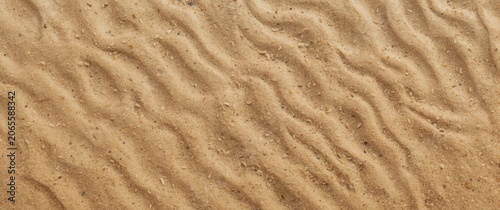 Textured sandy surface with...