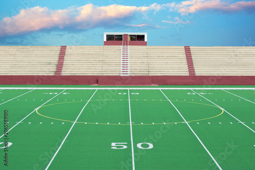 Fotografija American football stadium field marked with fifty yard line and bleachers footba