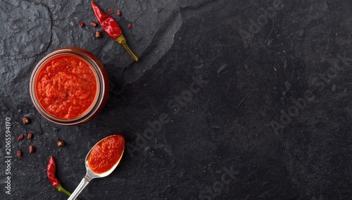 Spicy red Harissa in jar wi...