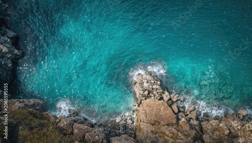 Turquoise ocean waves crash...