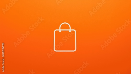 Shopping bag icon on an ora...