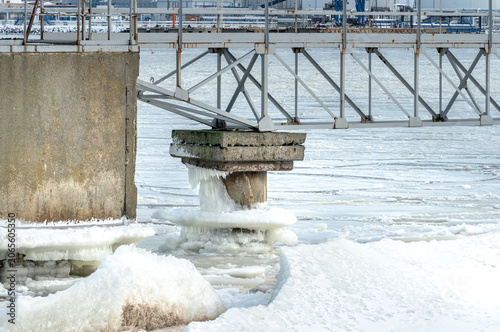 protective rocks of the breakwater covered with ice