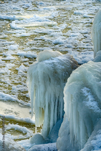 protective rocks of the breakwater covered with ice