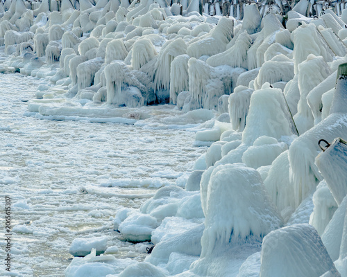 protective rocks of the breakwater covered with ice