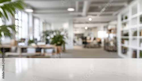 Clean Marble Table Surface Foreground with Blurred Bright Modern Office Interior Background Natural Light Plants and Shelving Units in Daylight