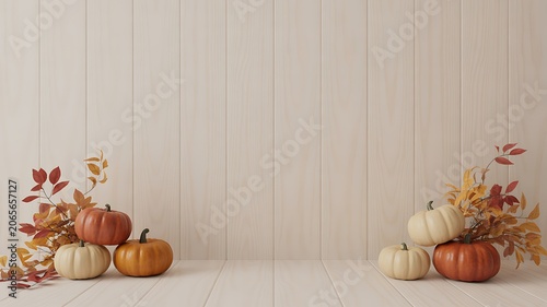 Seasonal decorative pumpkins and autumn leaves arranged on light wooden background for fall harvest theme