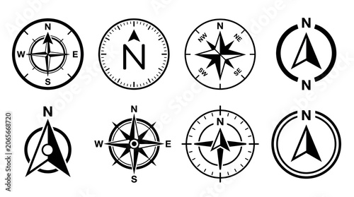 Set of Compass and Navigation Symbols: A collection of eight distinct compass rose and north arrow icons, presented in a clean, graphic style, symbolizing direction, guidance, and exploration.