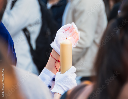 Canvastavla Lone candle guiding devotion through Granada’s solemn holy week procession