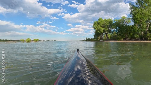 Immersive POV from a kayak - paddling on Boedecker Reservoir in Loveland, Colorado with water vegetation