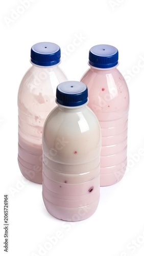Three plastic bottles with pink liquids and blue caps on white