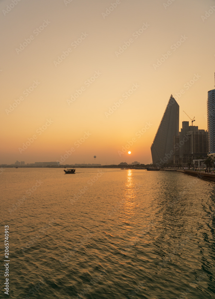 Fototapeta premium Vibrant Doha Corniche Waterfront with Tourists Enjoying Sea Views