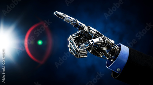 Robotic hand in blue shirt cuff pointing finger against dark blue background artificial