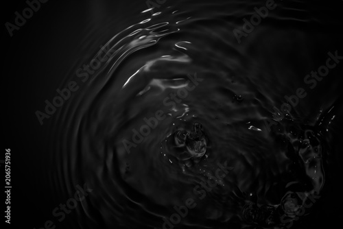 Dark Water Surface with Ripples and Waves Creating Abstract Patterns