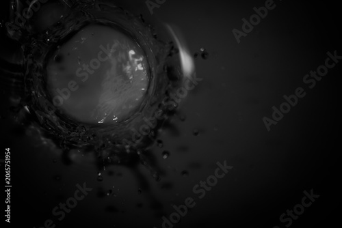 Black and White Water Splash with Droplets and Circular Motion