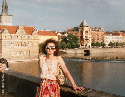 Authentic early 2000s woman traveler portrait on European waterfront