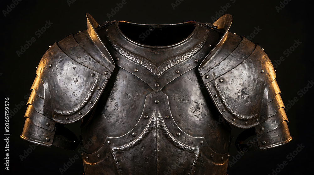 Fototapeta premium The ancient warrior's armor chest plate shines with metallic sheen and weathered battle marks.