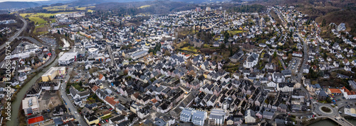Aerial view beside the old town above the city Herborn in Germany, on a sunny afternoon in autumn.