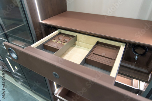 Fotografia Brown leather wardrobe drawer with automatic watch winder unit