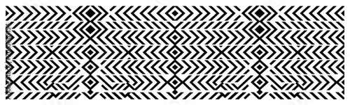 Schilderij op canvas Geometric chevron lines and diamond shapes create an abstract tribal seamless pa