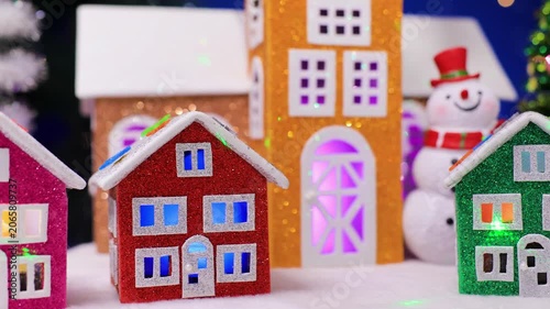 In Christmas Town, among large colorful houses, small colorful houses