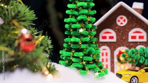 In the center of Christmas Town there is a small green Christmas tree