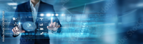 Quality controller reviewing metrics using hands executing a detailed Assessment protocol on a digital virtual screen showing performance benchmarks. Evaluating enterprise productivity.