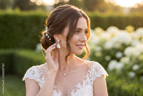 The bride wearing diamond earrings.